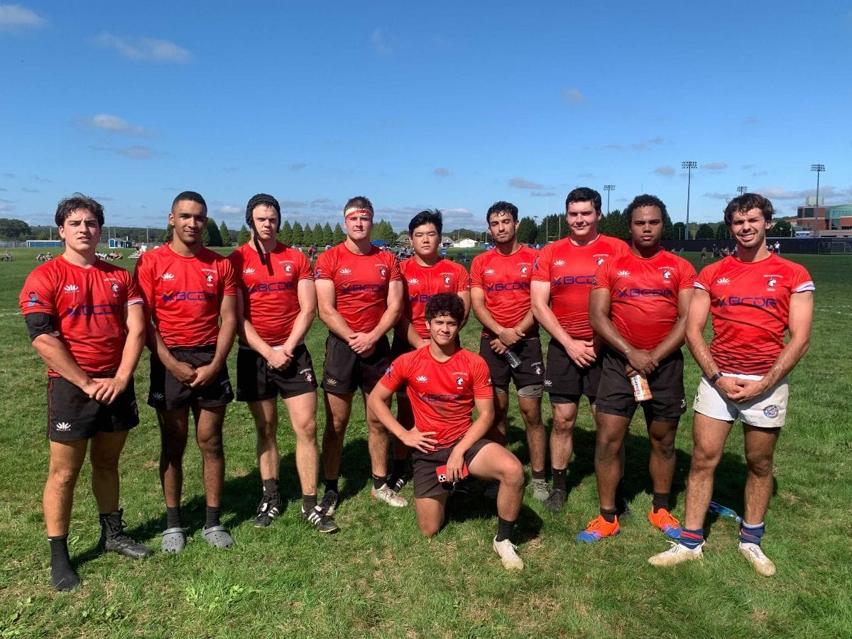 The Maddog forward pack salutes their rookie scrum half at URI