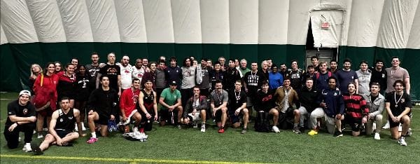Alumni and players in the Carter Field dome at the 2023 Memorial Touch Tournament