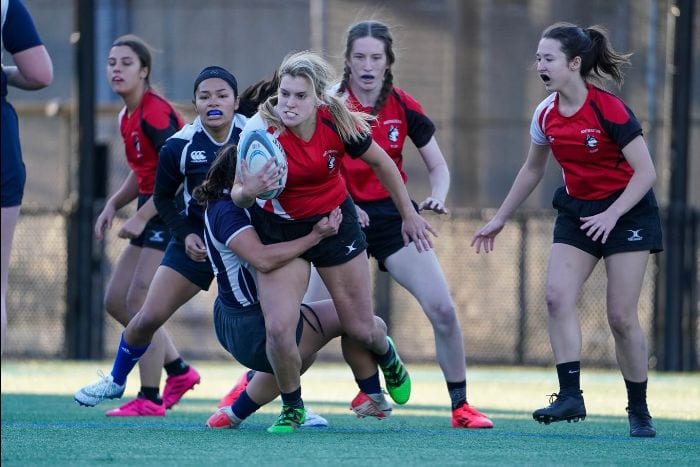 Northeastern women's players attacking with the ball